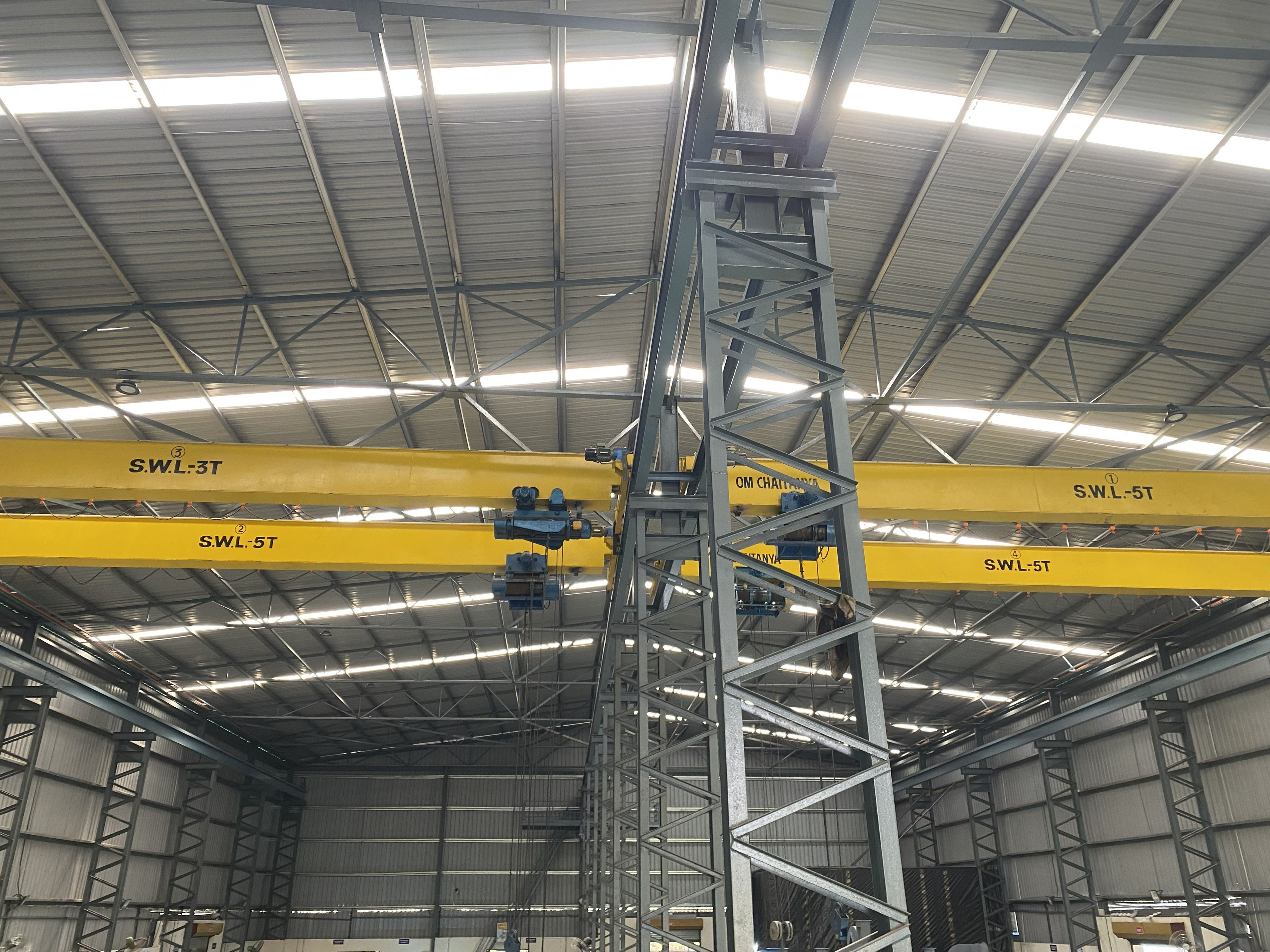 Overhead crane handling a large fan